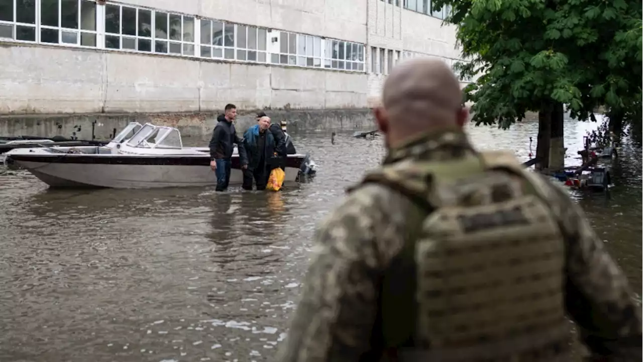 Rescuers are braving snipers and racing time to ferry Ukrainians out of Russian-occupied flood zones