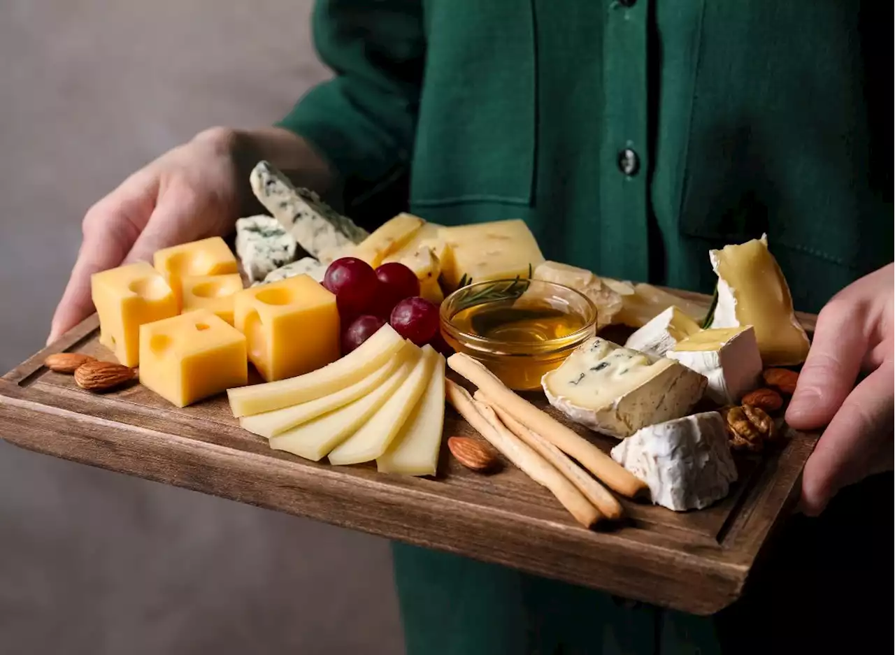 12 Side Effects of Eating Too Much Cheese, According to Dietitians