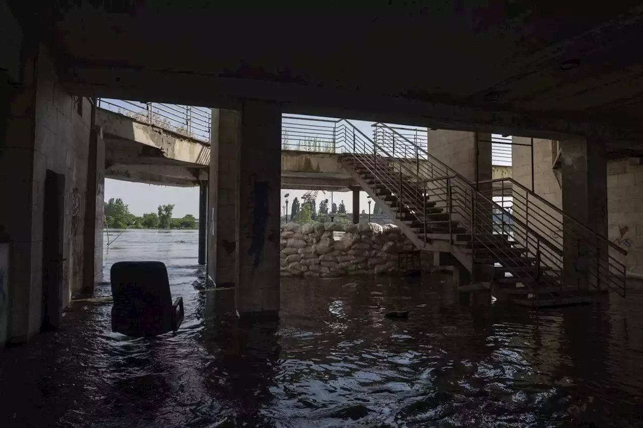 Rescuers ferry Ukrainians from Russia-occupied flood zones despite snipers