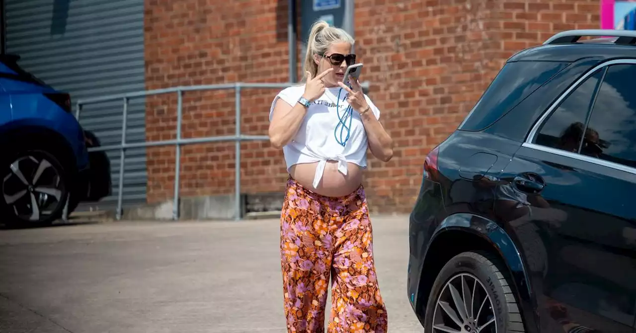 Gemma Atkinson proudly shows off baby bump in a crop top before due date