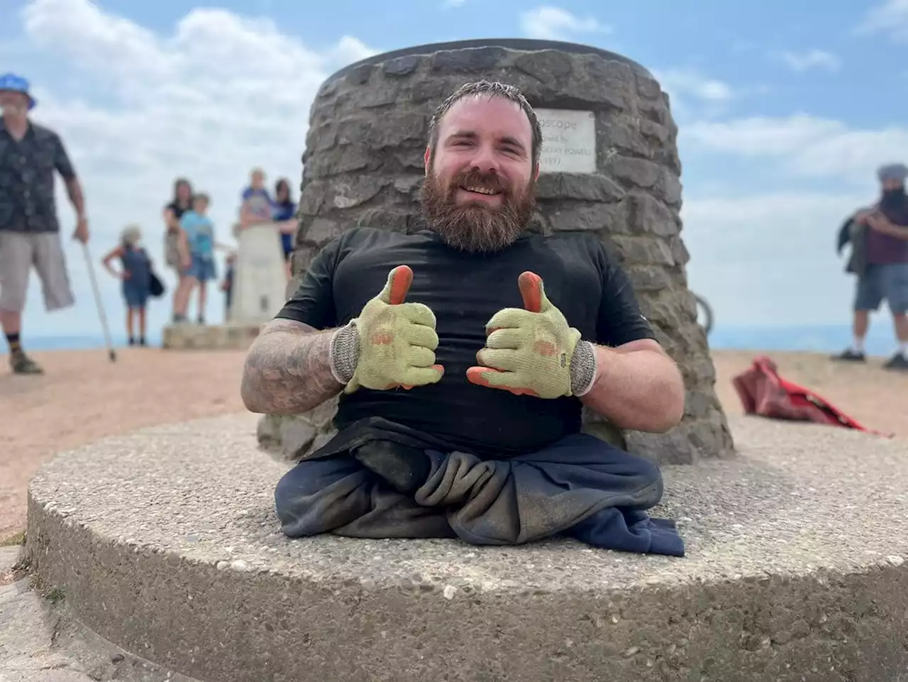 Paralympian fundraiser Mickey Bushell climbs the Wrekin on his hands