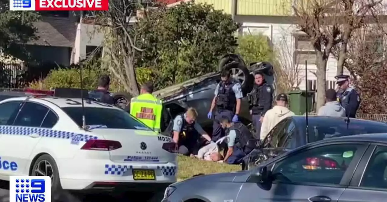 Driver flips car after police pursuit in Sydney's west