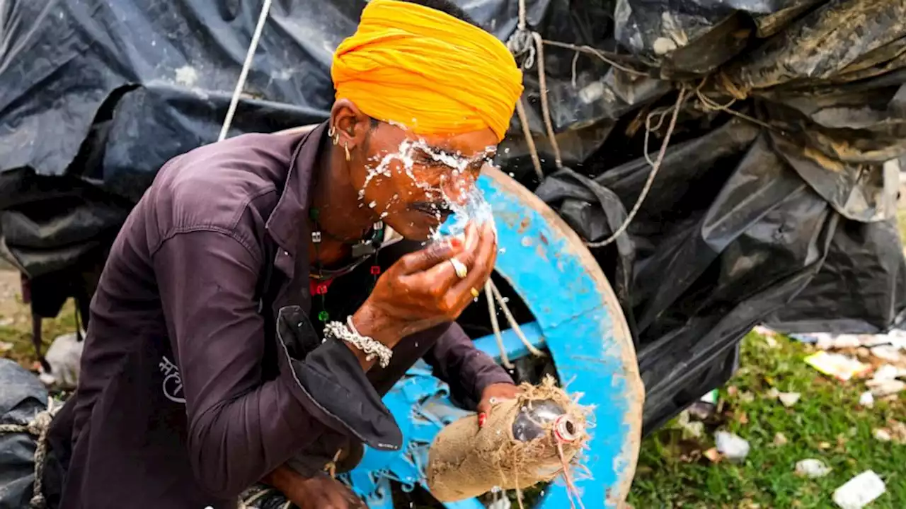 Nearly 100 die as India struggles with a sweltering heat wave in 2 most populous states