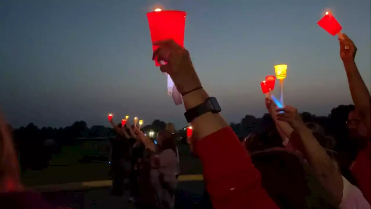 Candlelight vigil for 3 boys murdered held at elementary school oldest brother attended