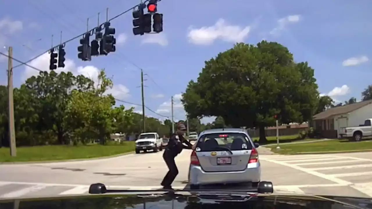 Watch: Quick-thinking police officer stops unresponsive driver's car