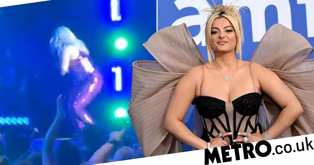 Bebe Rexha smacked in face by fan's phone before collapsing on stage