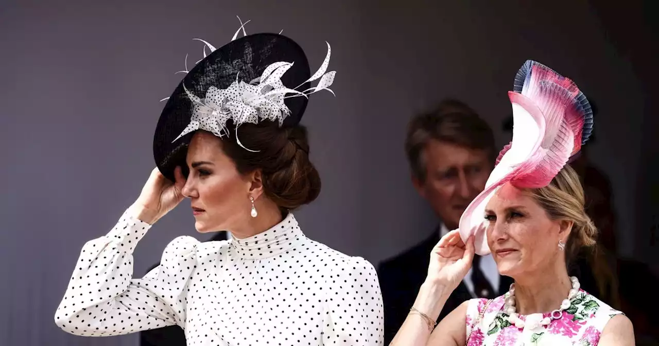 Windswept royals hold on to their hats at Royal Garter ceremony