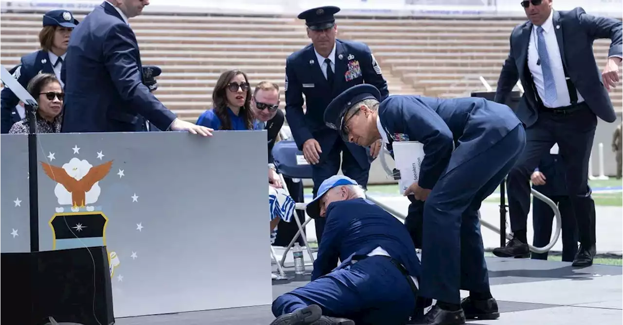 US President Joe Biden trips and falls on stage at ceremony