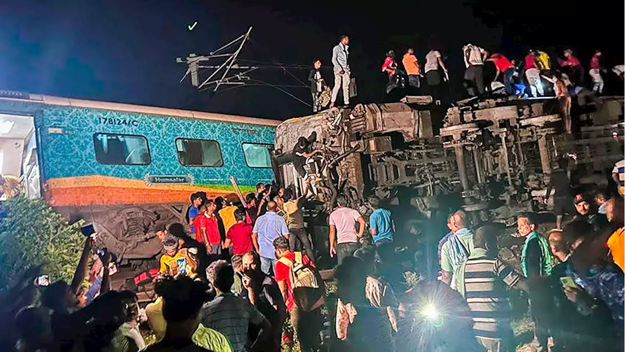 Passenger train derails in India, killing at least 50 and trapping many others