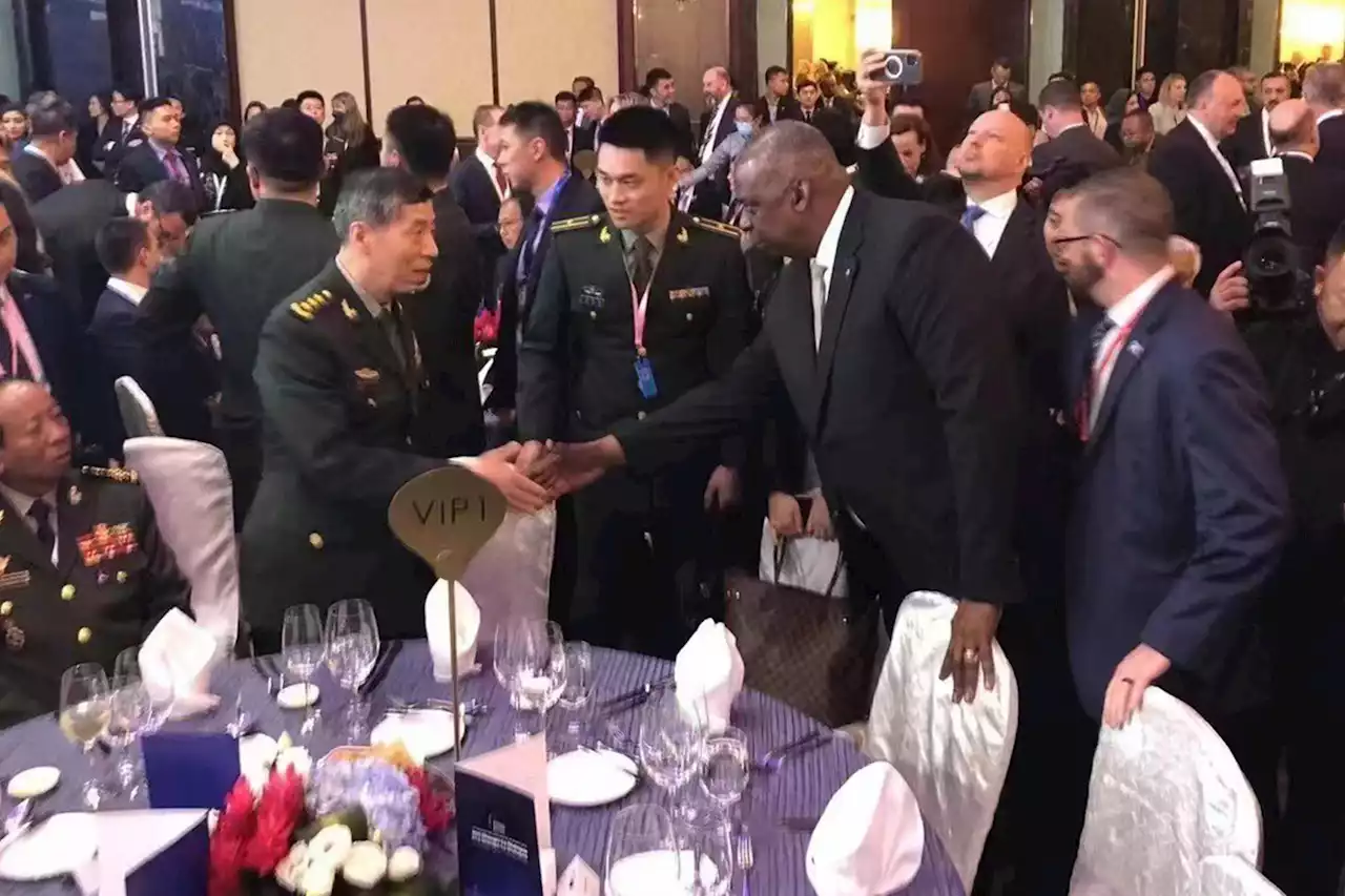 US Defense Secretary Lloyd Austin greets Chinese counterpart at summit after Beijing blocks talks