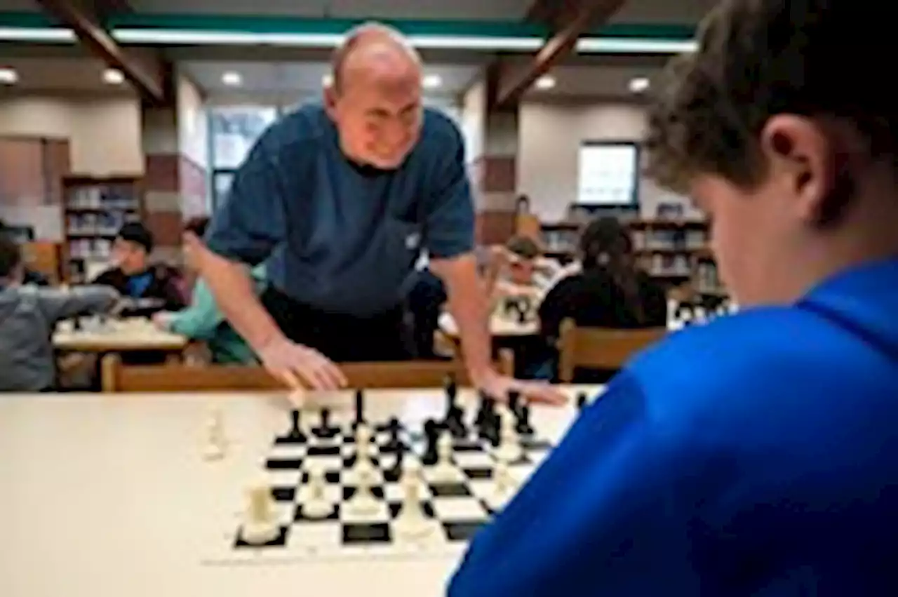 School custodian leads student chess teams to victory