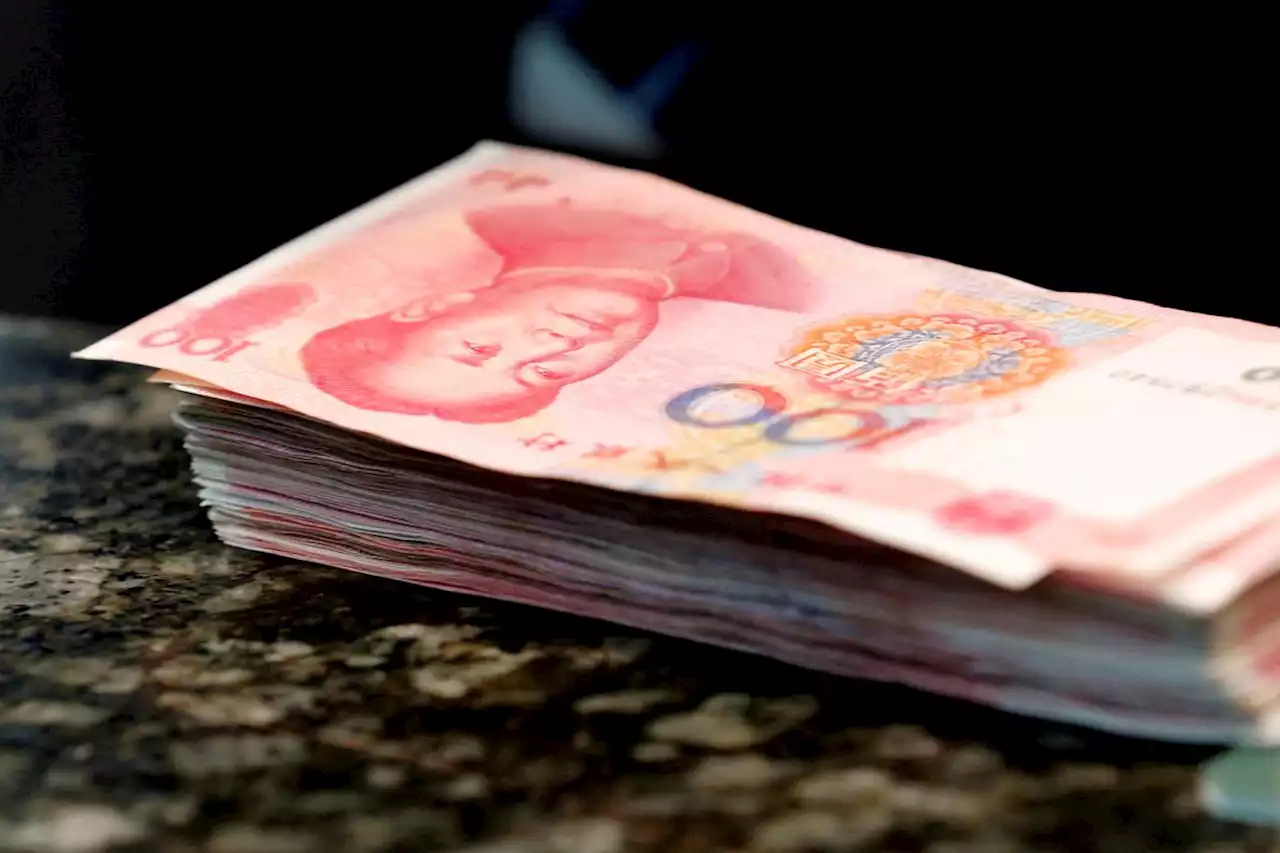 China cuts lending benchmarks for first time in 10 months to spur growth in the economy