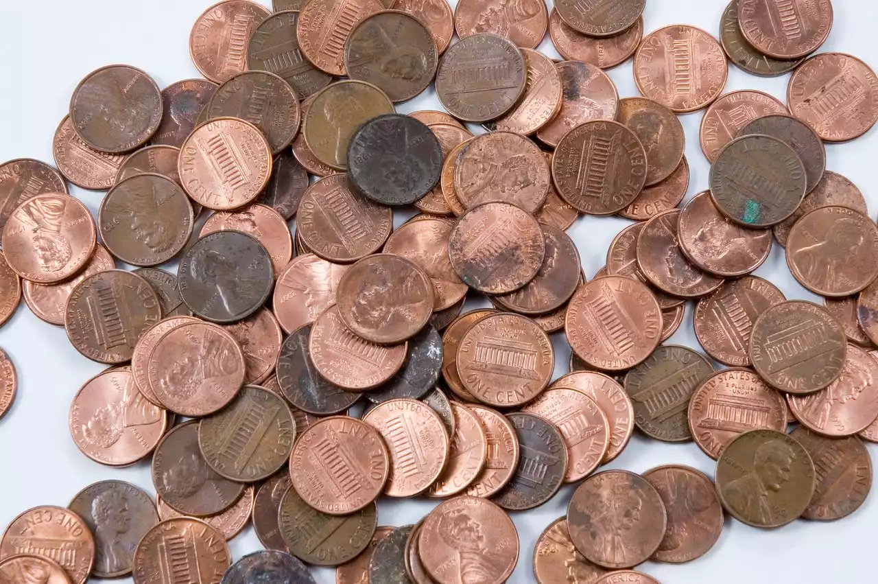 Auto shop ordered to give back wages to worker paid in oily pennies