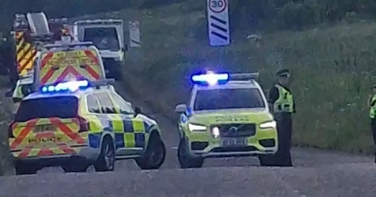 Road closed as car crashes near busy Scots railway line