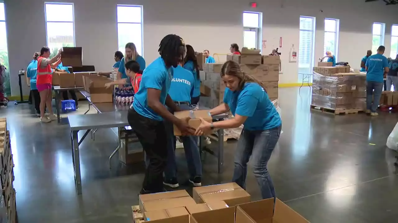 North Texas Food Bank volunteers putting together disaster relief kits