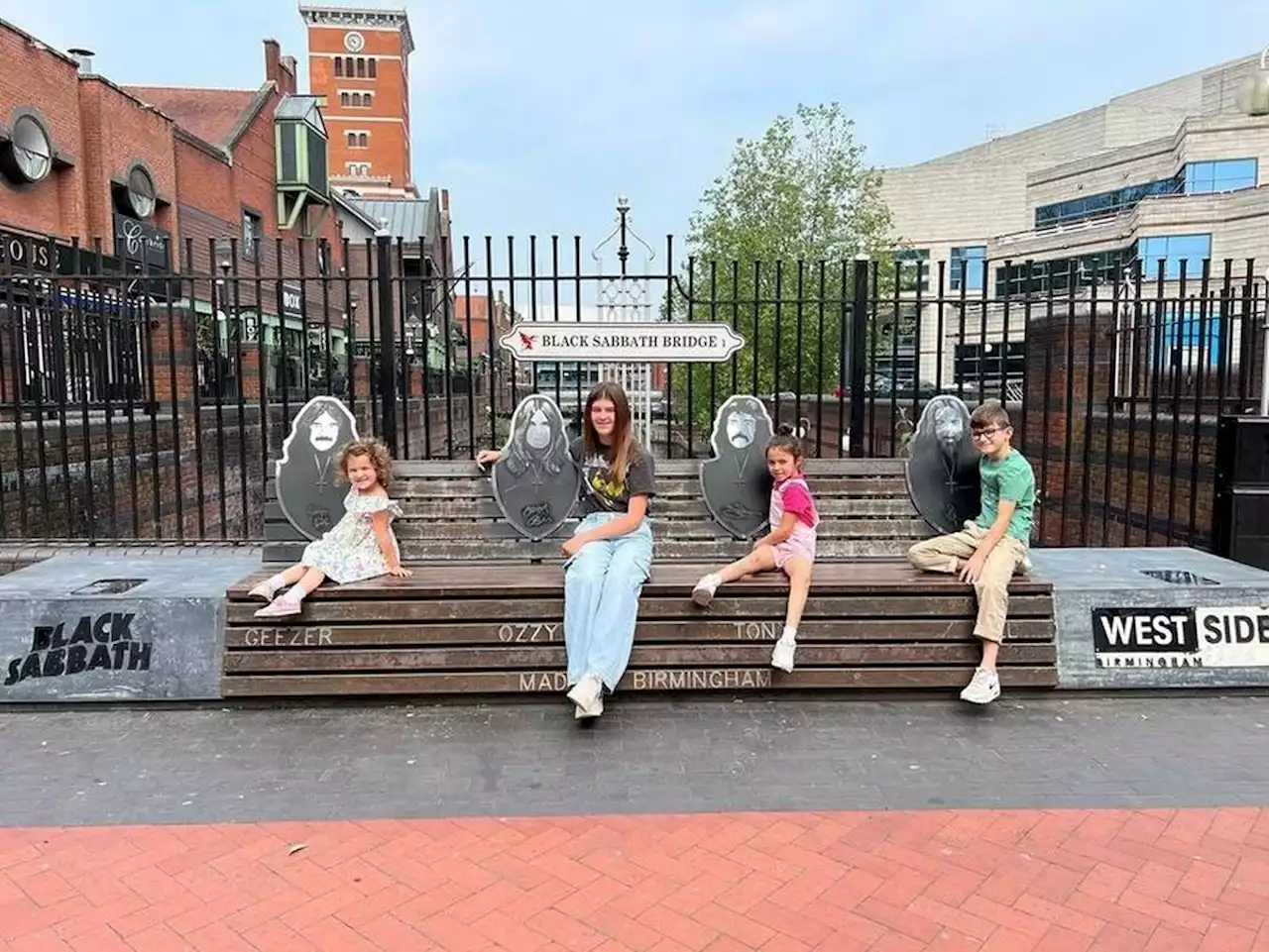 Rock star Geezer Butler's grandchildren pictured on Black Sabbath Bench in Birmingham