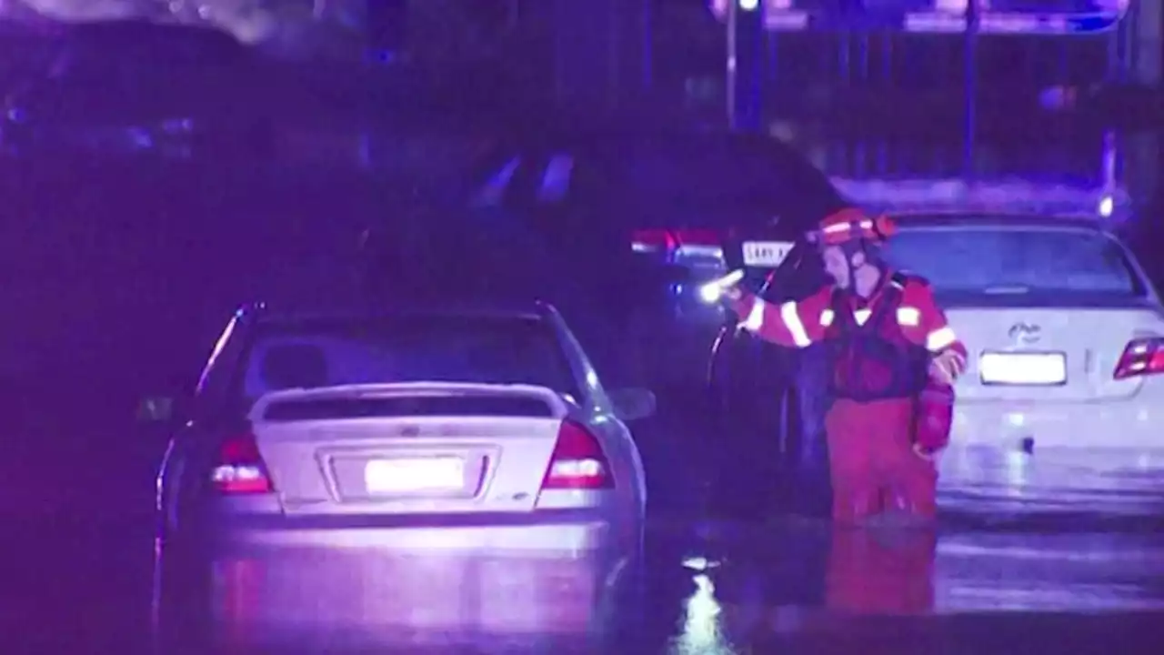 People rescued from floodwaters after heavy rain left roads flooded in Adelaide