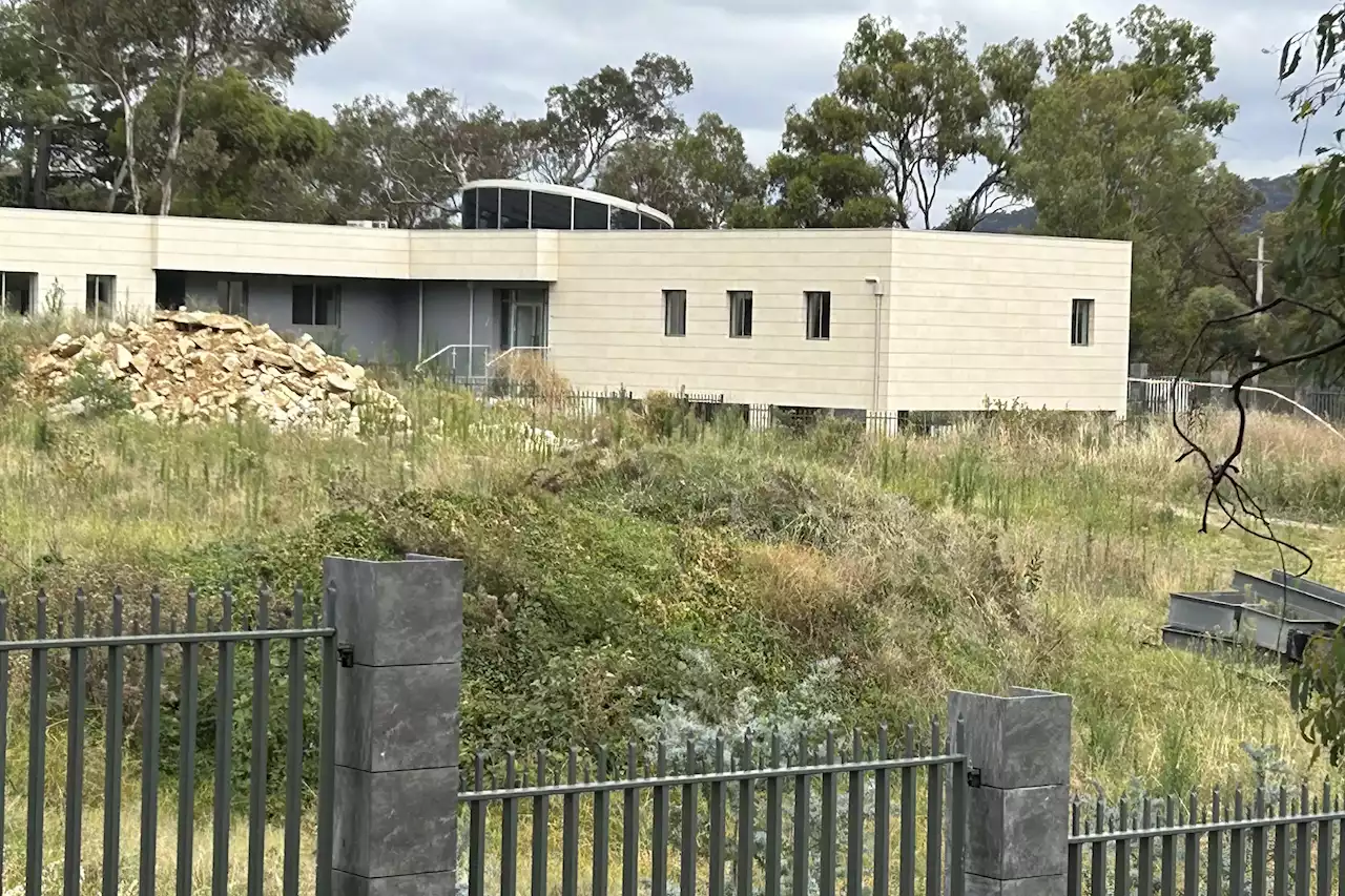 A suspected Russian diplomat is occupying his country's vetoed embassy site in Australia