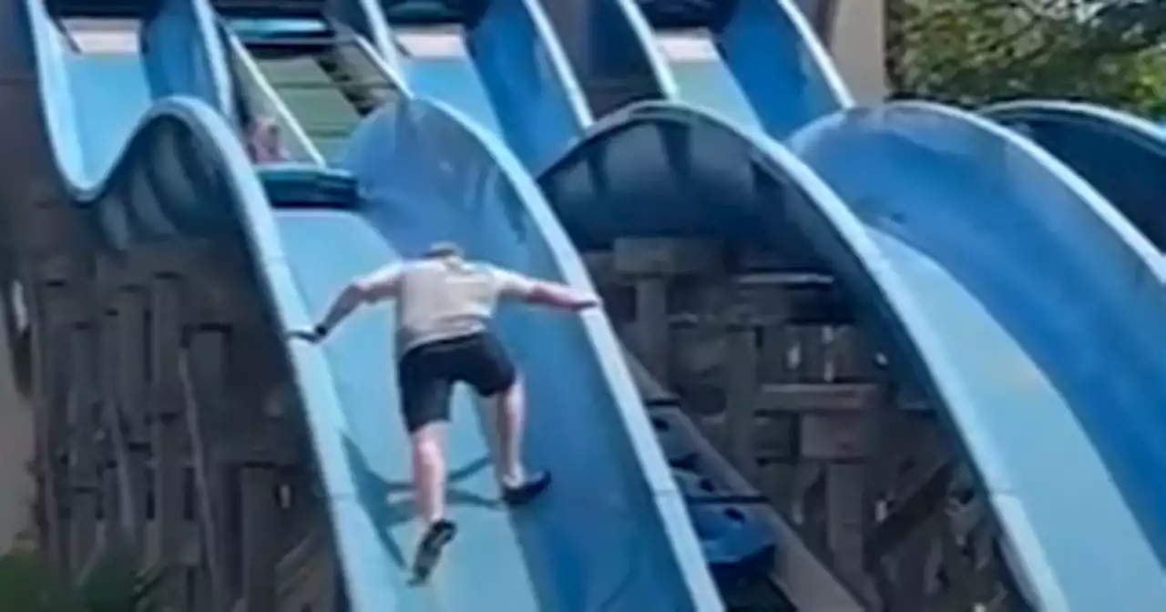 'Super dad' clambers up slide at water park to save stuck daughter