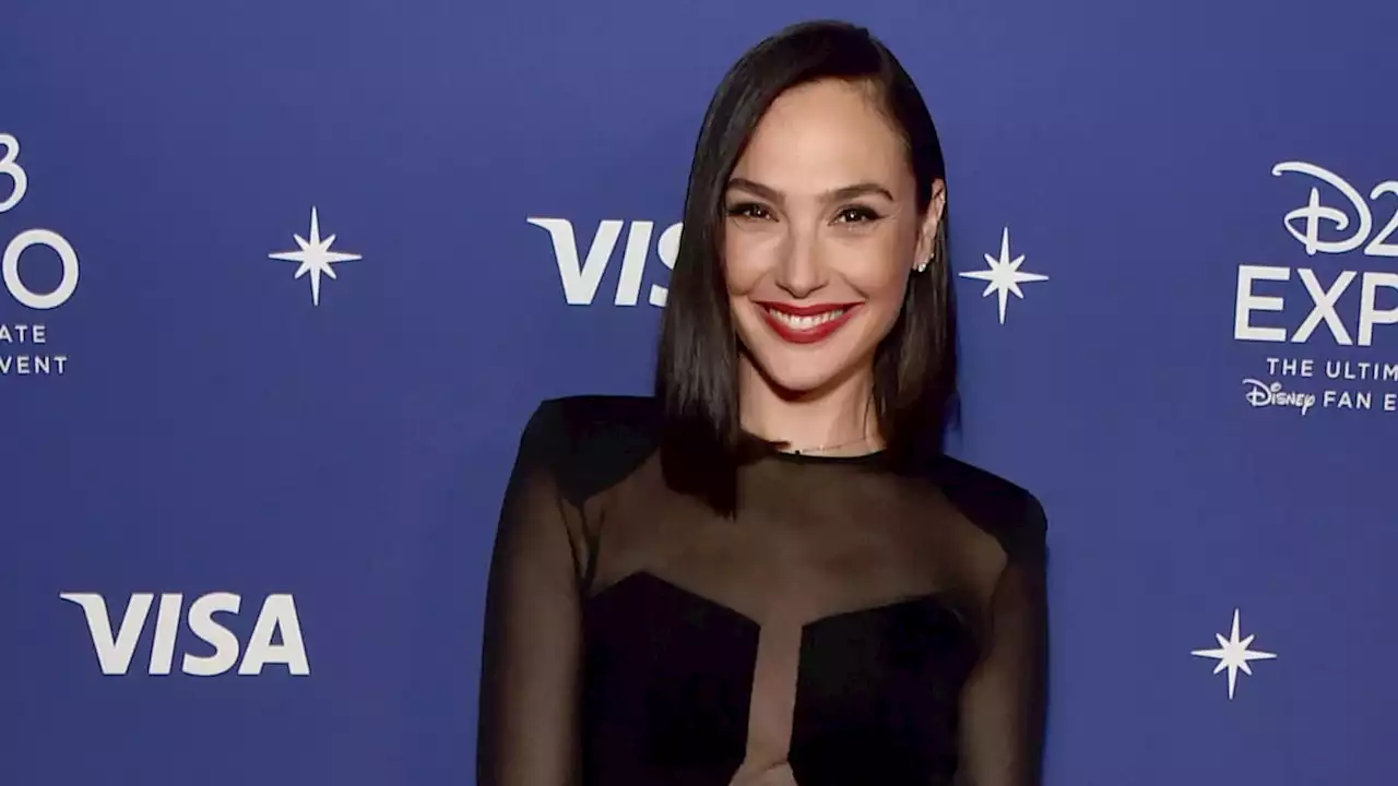 Gal Gadot pours her curves into figure-hugging dress of dreams – wow
