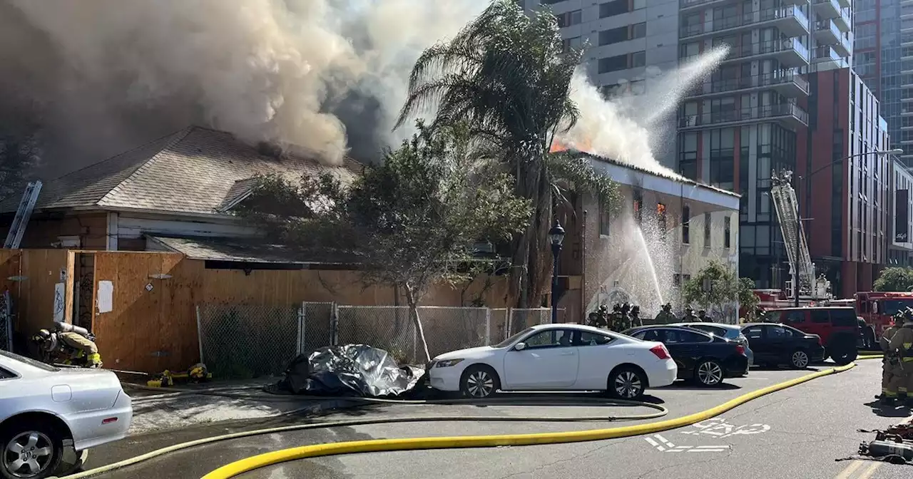 Firefighters working to put out two-alarm fire at abandoned home