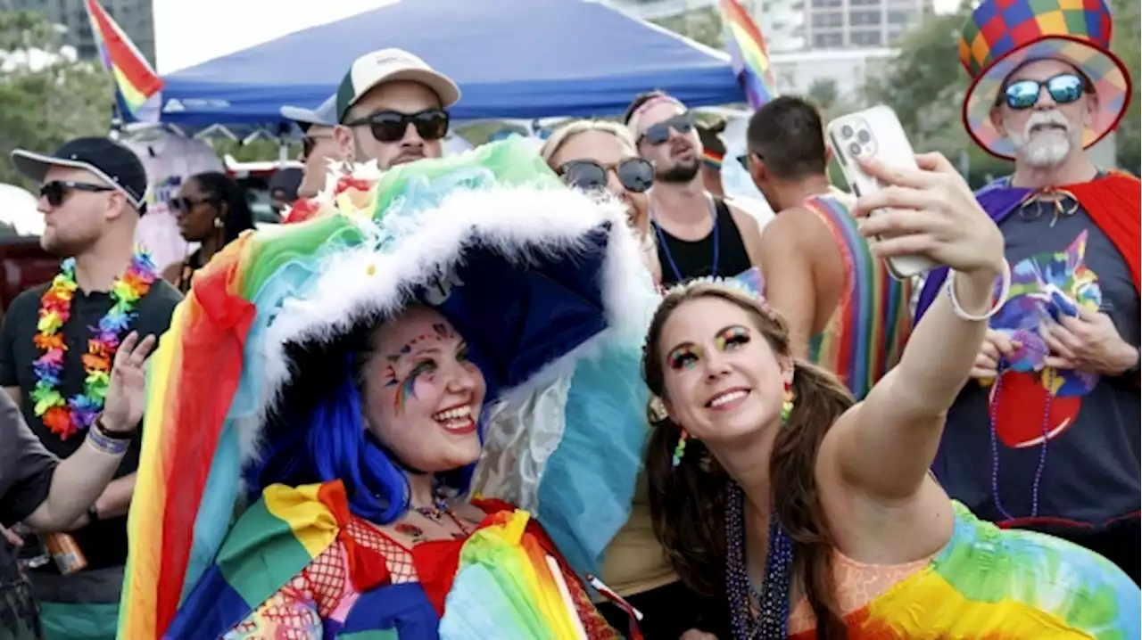 Party and protest mix as LGBTQ+ pride parades kick off from New York to San Francisco