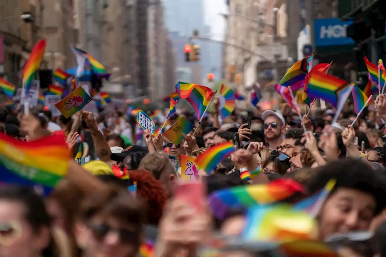 Party and protest mix as Pride parades kick off from New York to San Francisco