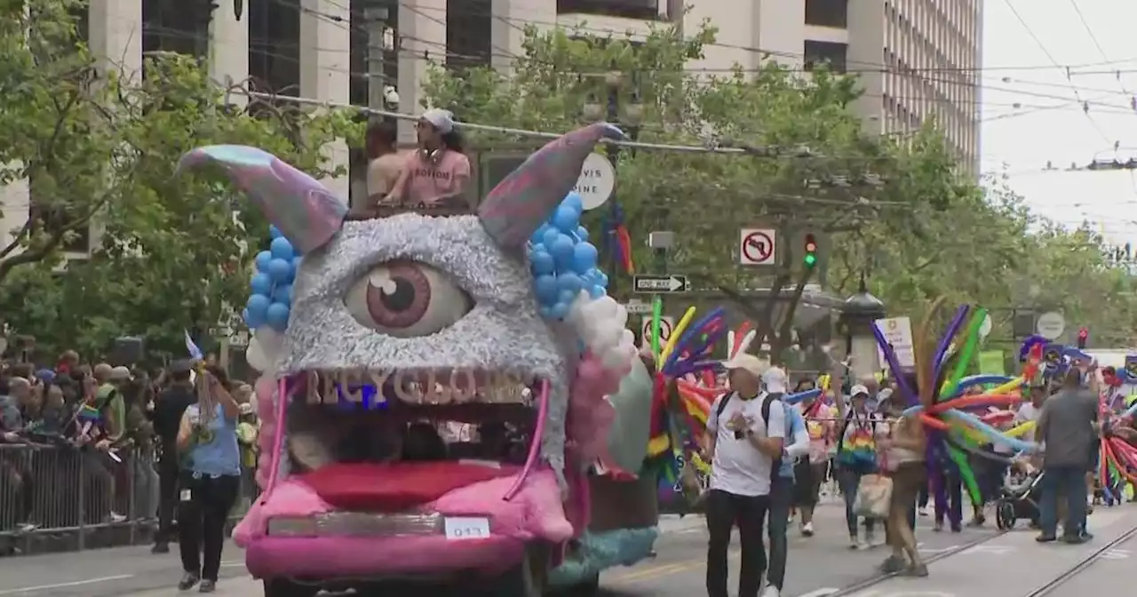 LGBTQ+ Pride revelers flash feathers and flags in the streets from New York to San Francisco