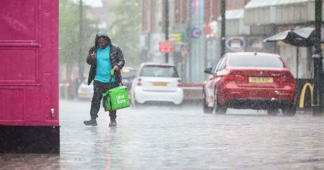 Heatwave comes to abrupt end as torrential rain batters Greater Manchester