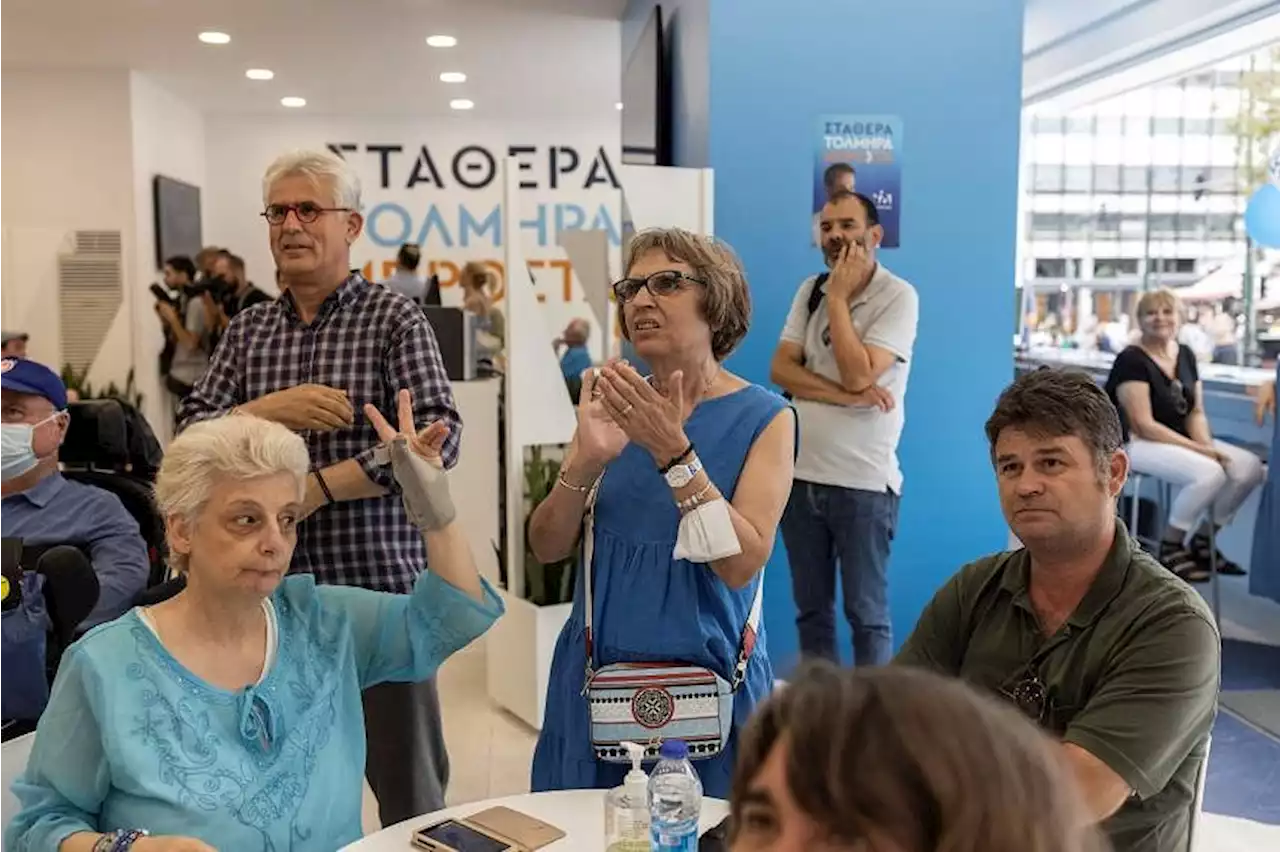 Greek conservatives storm to victory in repeat election