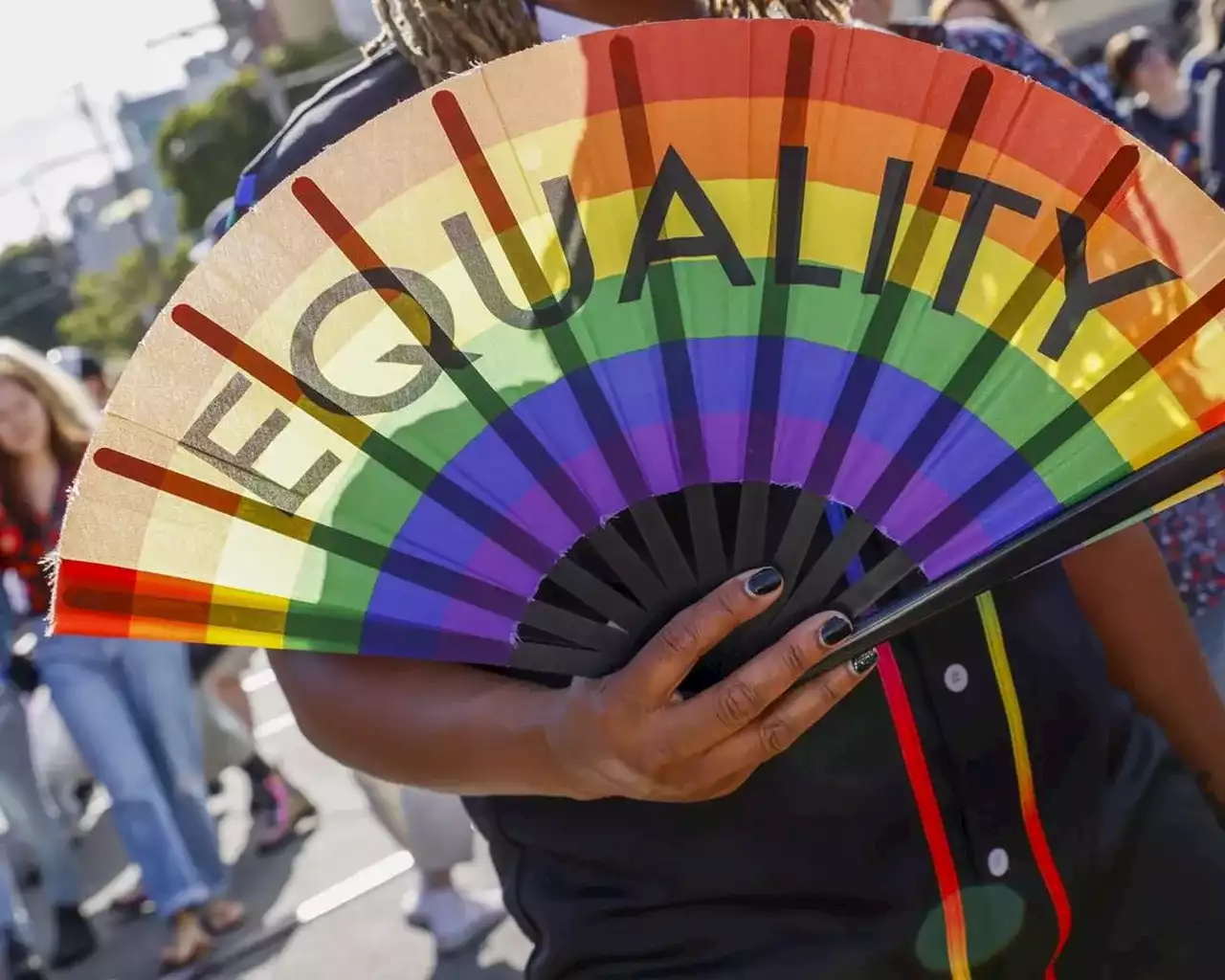 Party and protest mix as LGBTQ+ pride parades kick off from New York to San Francisco