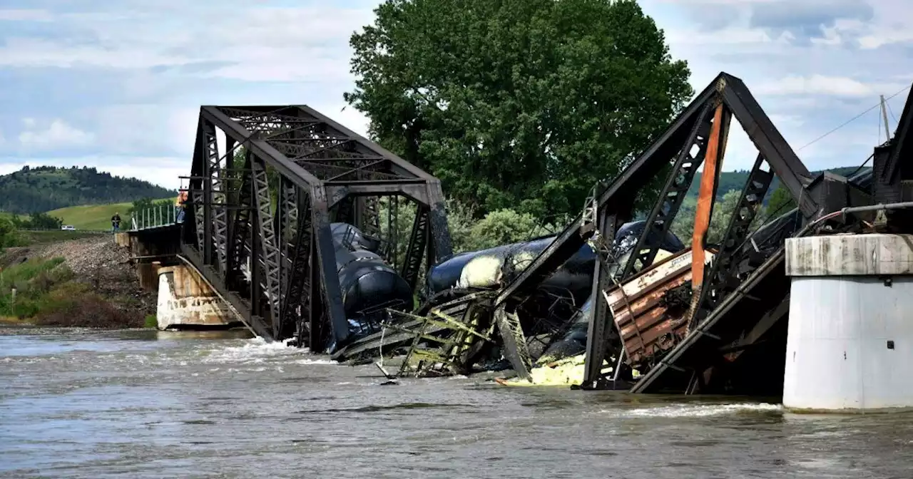 Train derailment on Montana bridge sends multiple rail cars into the Yellowstone River