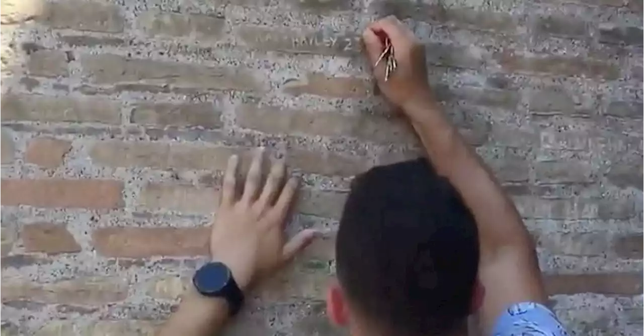 Italy vows to find and punish tourist who defaced Colosseum wall