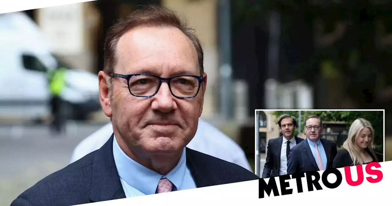 Kevin Spacey smiles and waves arriving at court for sex assault trial