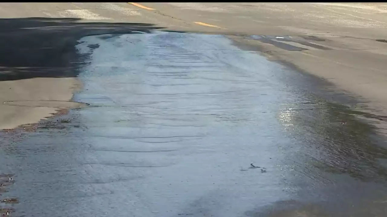 Thousands of gallons of water seep through a Granada Hills street