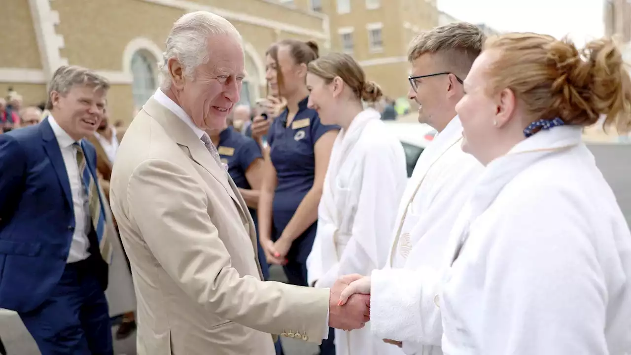 King Charles and Queen Camilla surprise spa guests in bathrobes in Poundbury eco-village