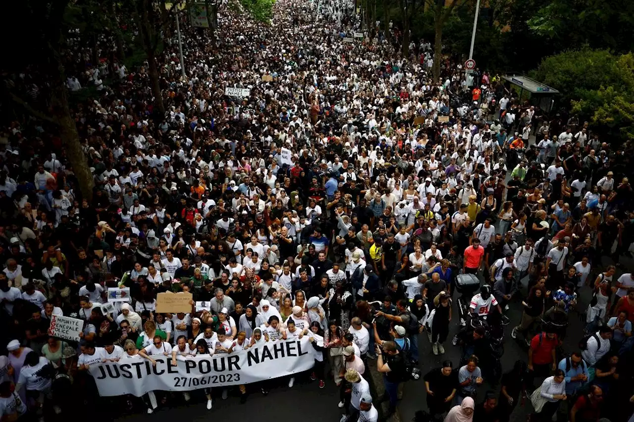 France unrest: Riots spread, thousands march in memory of shot teenager