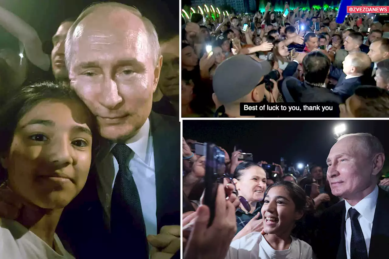 Putin seen on Russian TV being mobbed by adoring supporters in bizarre public appearance