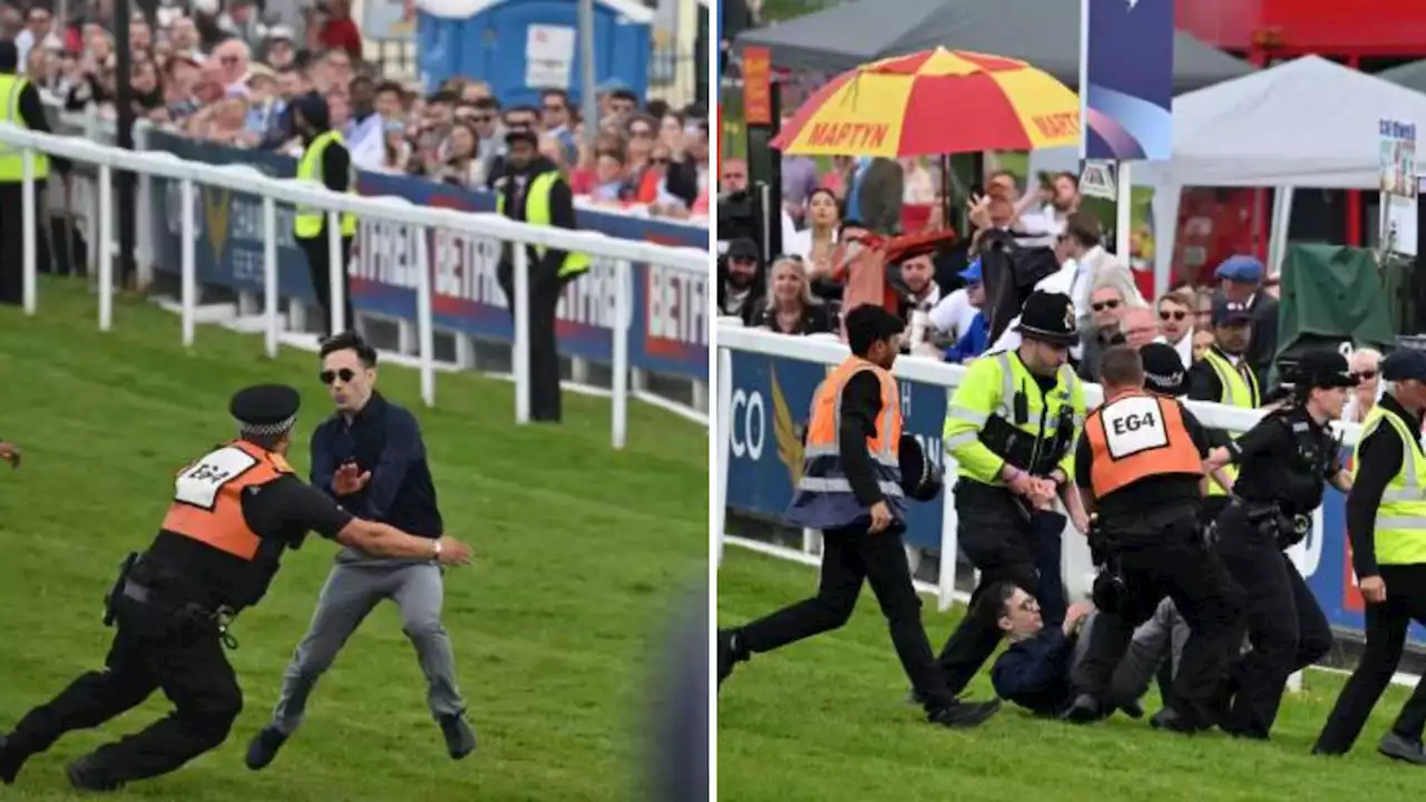 Two protesters arrested after running across the track to disrupt the Derby