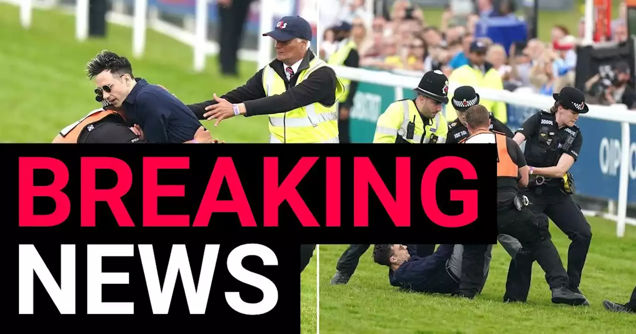 Two protesters arrested at Epsom Derby after running on racecourse