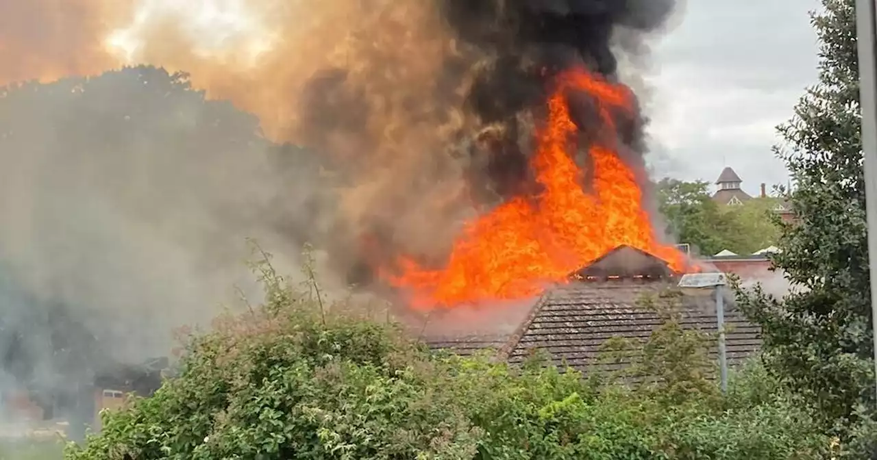 Police cordon around fire-hit school after young people gather