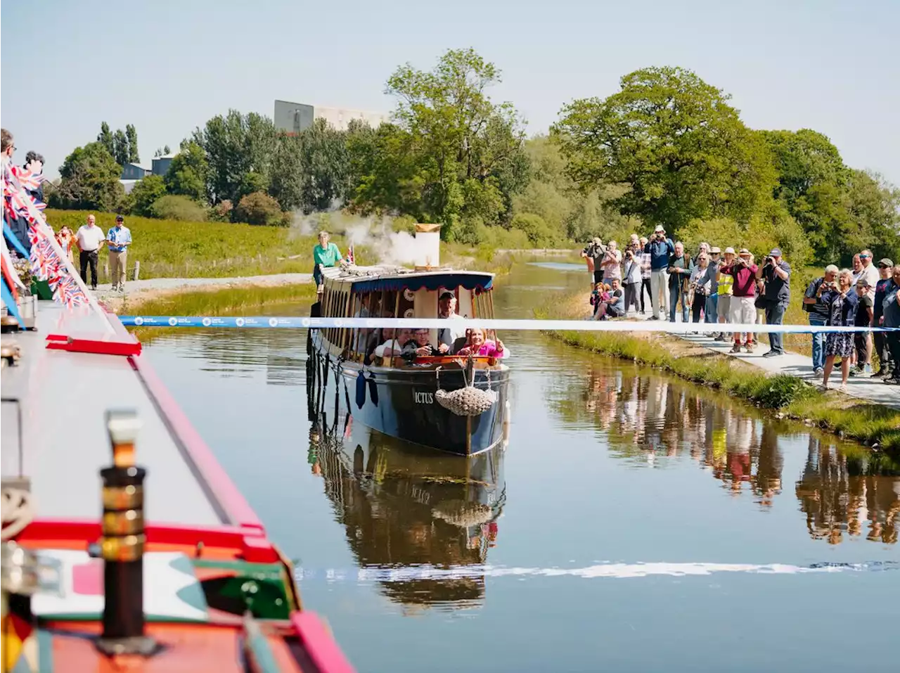 Canal officially re-opens with a sea shanty as boat slices through ribbon