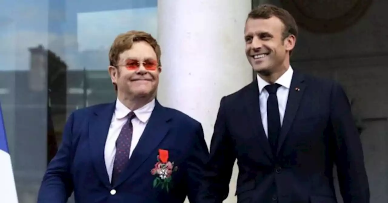 Macron Partied With Elton John as France Burned