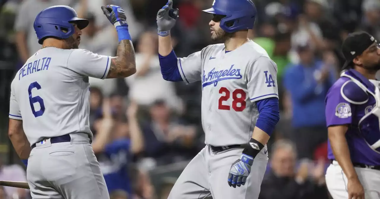 Dodgers come up swinging after weather delay to rout Rockies