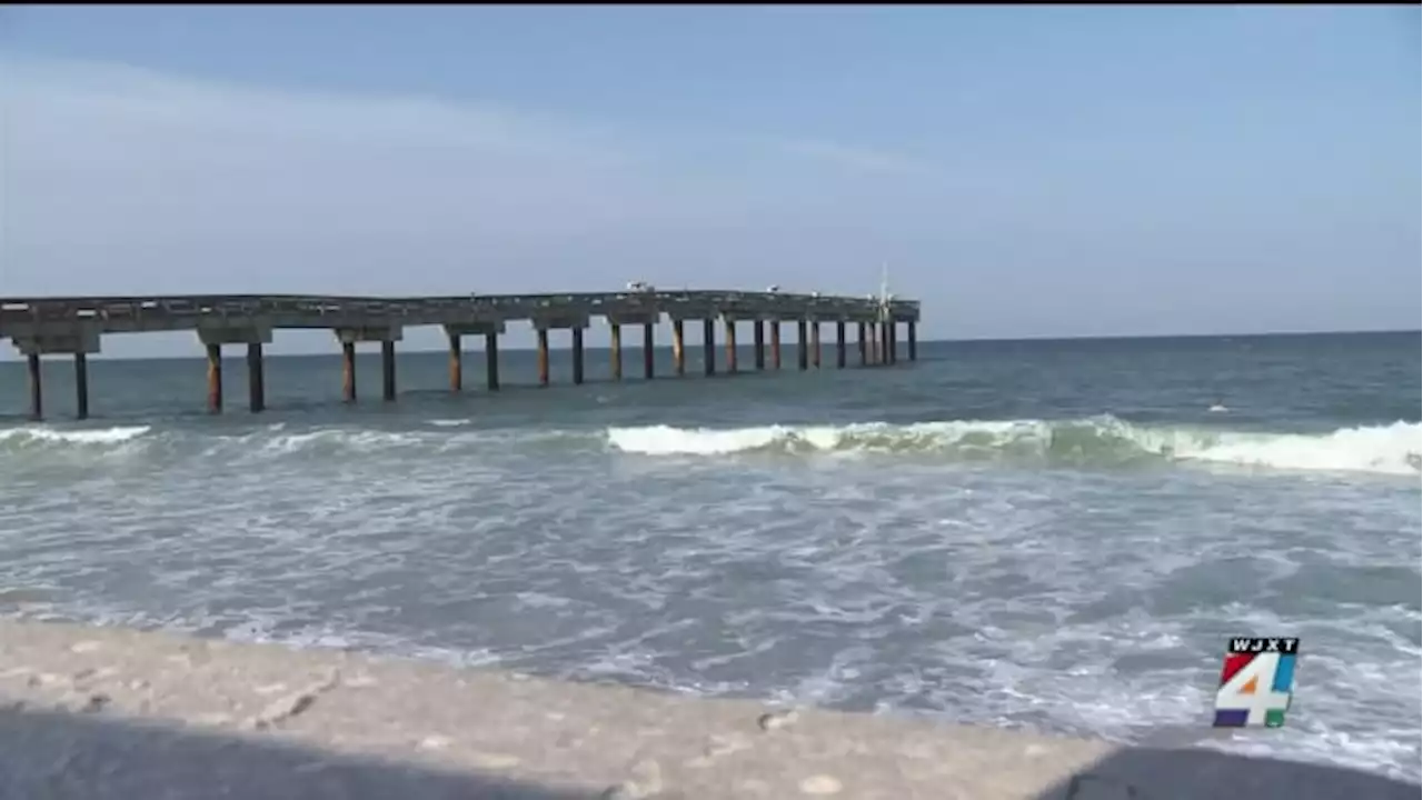 Numerous people rescued from choppy beach waters as red, purple flags signal warning to swimmers