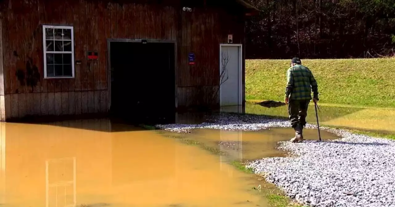 Man builds dam on property line, flooding out neighbors' yard