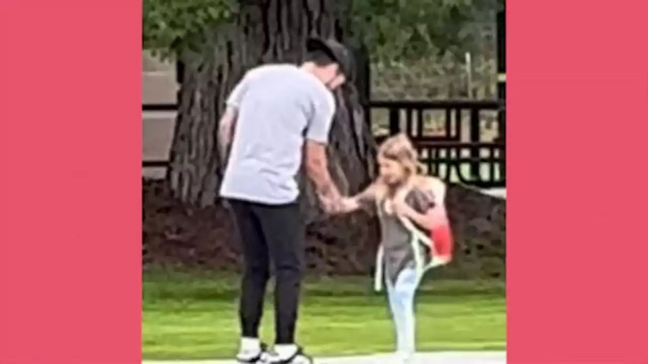 Dad and daughter show off special handshake after school