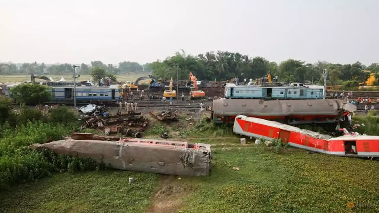 Families, rescuers search for victims of India's worst train crash in decades