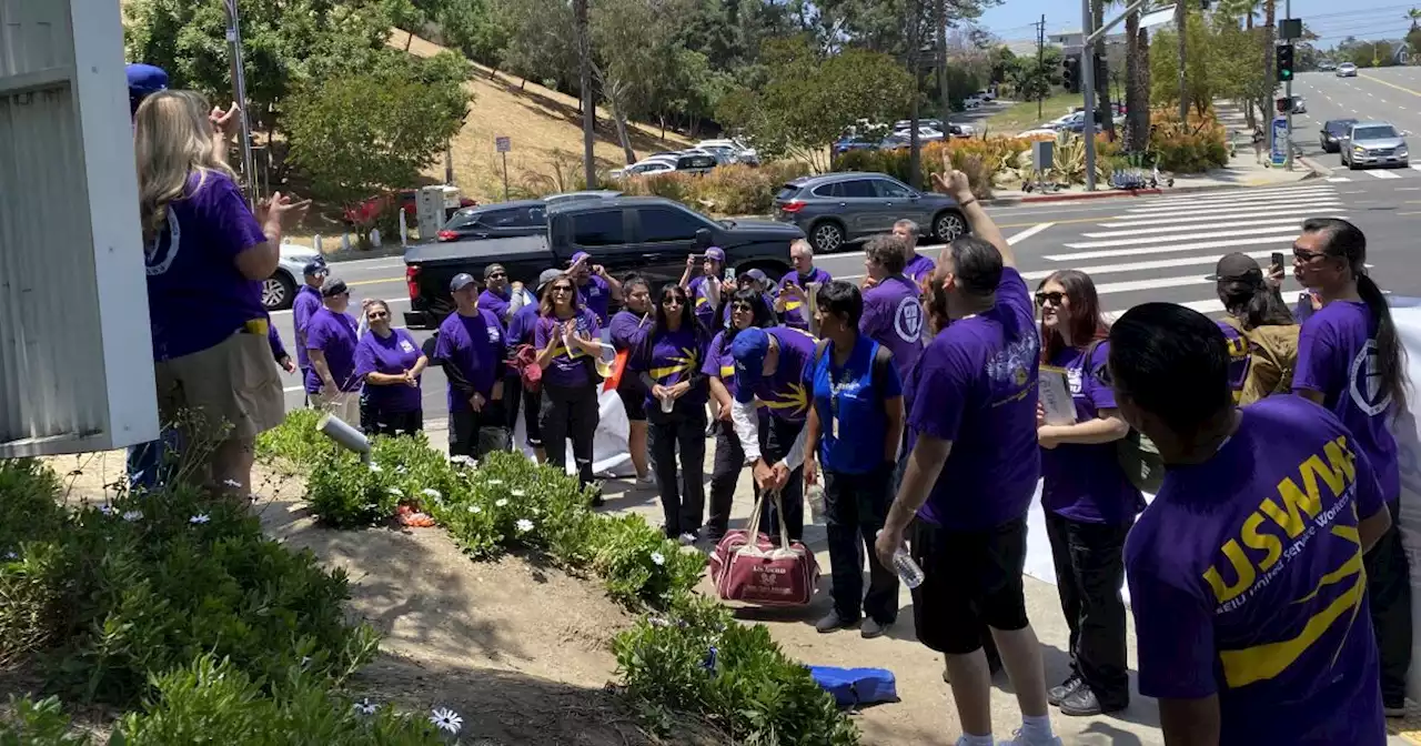 Dodger Stadium game-day workers protest, threaten to go on strike