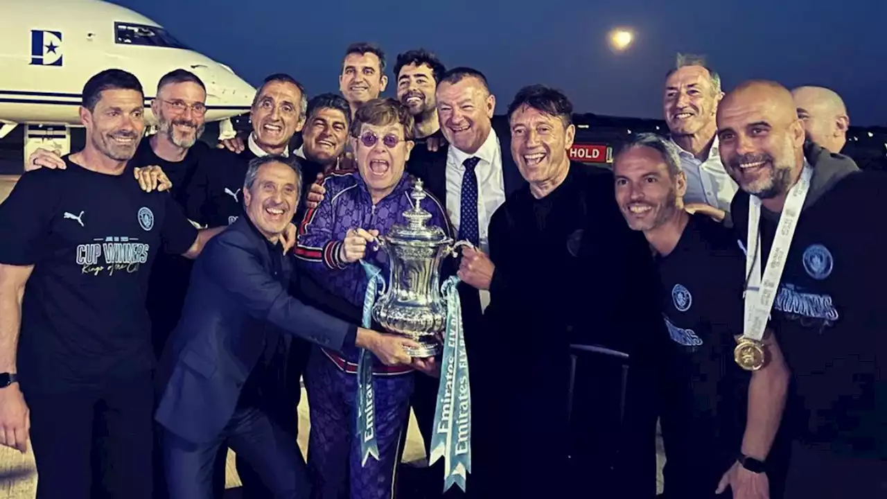 Manchester City serenade Sir Elton John at airport after FA Cup final win